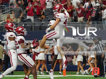 Arkansas Razorbacks wide receiver Isaac TeSlaa #4 celebrates after scoring a touchdown during the Southwest Classic match between the Arkans...