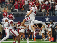 Arkansas Razorbacks wide receiver Isaac TeSlaa #4 celebrates after scoring a touchdown during the Southwest Classic match between the Arkans...