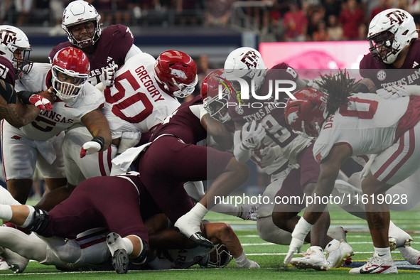 Texas A&M Aggies running back Le'Veon Moss #8 runs the ball against the Arkansas Razorbacks during the Southwest Classic match between the A...