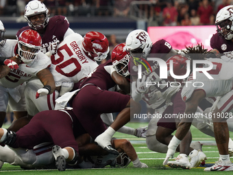 Texas A&M Aggies running back Le'Veon Moss #8 runs the ball against the Arkansas Razorbacks during the Southwest Classic match between the A...