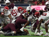 Texas A&M Aggies running back Le'Veon Moss #8 runs the ball against the Arkansas Razorbacks during the Southwest Classic match between the A...