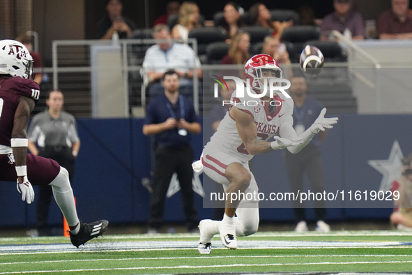 Arkansas Razorbacks Wide Receiver Isaiah Sategna #6 catches the ball against Texas A&M Razorbacks during the Southwest Classic match between...