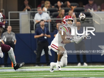 Arkansas Razorbacks Wide Receiver Isaiah Sategna #6 catches the ball against Texas A&M Razorbacks during the Southwest Classic match between...