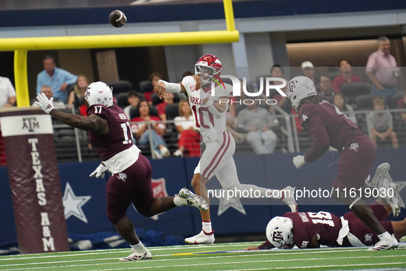 Arkansas Razorbacks quarterback Taylen Green #10 passes the ball against Texas A&M during the Southwest Classic match between the Arkansas R...