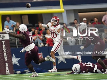 Arkansas Razorbacks quarterback Taylen Green #10 passes the ball against Texas A&M during the Southwest Classic match between the Arkansas R...