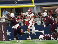 Arkansas Razorbacks quarterback Taylen Green #10 passes the ball against Texas A&M during the Southwest Classic match between the Arkansas R...