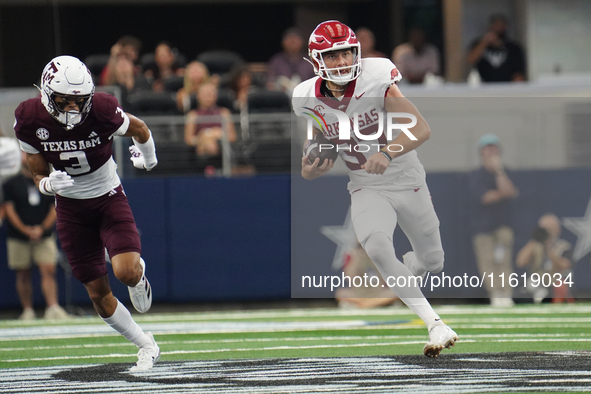 Arkansas Razorbacks punter Devin Bale #37 runs the ball against Texas A&M Aggies during the Southwest Classic match between the Arkansas Raz...