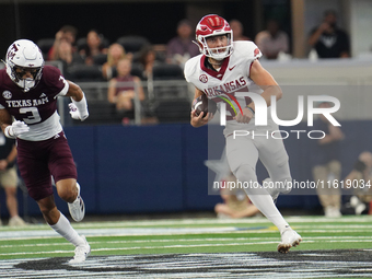 Arkansas Razorbacks punter Devin Bale #37 runs the ball against Texas A&M Aggies during the Southwest Classic match between the Arkansas Raz...