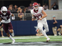 Arkansas Razorbacks punter Devin Bale #37 runs the ball against Texas A&M Aggies during the Southwest Classic match between the Arkansas Raz...