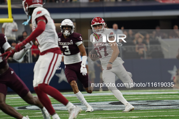 Arkansas Razorbacks punter Devin Bale #37 runs the ball against Texas A&M Aggies during the Southwest Classic match between the Arkansas Raz...