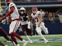 Arkansas Razorbacks punter Devin Bale #37 runs the ball against Texas A&M Aggies during the Southwest Classic match between the Arkansas Raz...