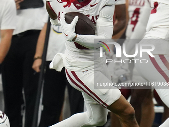 Arkansas Razorbacks Wide Receiver Isaiah Sategna #6 catches the ball against Texas A&M Razorbacks during the Southwest Classic match between...