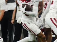 Arkansas Razorbacks Wide Receiver Isaiah Sategna #6 catches the ball against Texas A&M Razorbacks during the Southwest Classic match between...