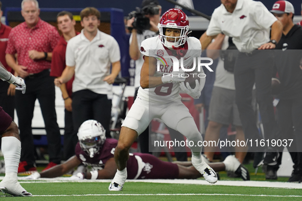 Arkansas Razorbacks Wide Receiver Isaiah Sategna #6 catches the ball against Texas A&M Razorbacks during the Southwest Classic match between...