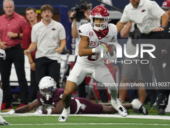 Arkansas Razorbacks Wide Receiver Isaiah Sategna #6 catches the ball against Texas A&M Razorbacks during the Southwest Classic match between...