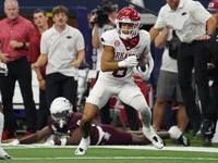 Arkansas Razorbacks Wide Receiver Isaiah Sategna #6 catches the ball against Texas A&M Razorbacks during the Southwest Classic match between...