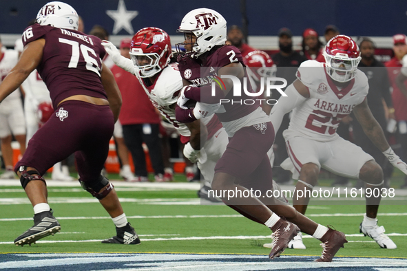 Texas A&M Aggies running back Rueben Owens #8 carries the ball against the Arkansas Razorbacks during the Southwest Classic match between th...