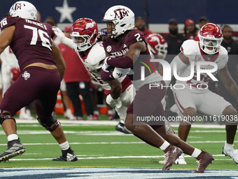 Texas A&M Aggies running back Rueben Owens #8 carries the ball against the Arkansas Razorbacks during the Southwest Classic match between th...