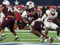 Texas A&M Aggies running back Rueben Owens #8 carries the ball against the Arkansas Razorbacks during the Southwest Classic match between th...