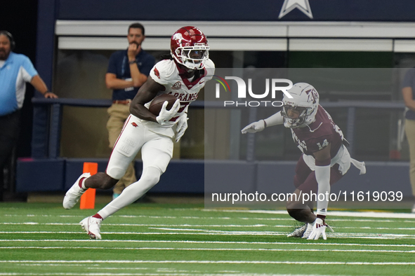 Arkansas Razorbacks wide receiver Andrew Armstrong #2 runs the ball against Texas A&M during the Southwest Classic match between the Arkansa...