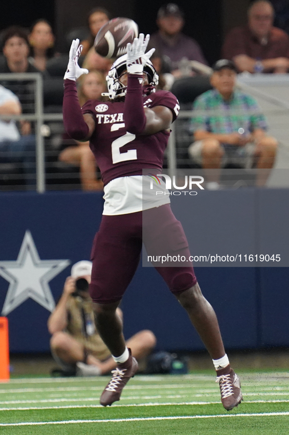 Texas A&M Aggies running back Rueben Owens #2 catches the ball against the Arkansas Razorbacks during the Southwest Classic match between th...