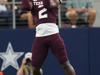 Texas A&M Aggies running back Rueben Owens #2 catches the ball against the Arkansas Razorbacks during the Southwest Classic match between th...