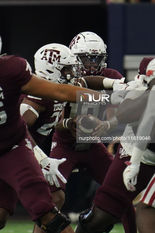 Texas A&M Aggies quarterback Marcel Reed #10 looks to pass the ball against the Arkansas Razorbacks during the Southwest Classic match betwe...