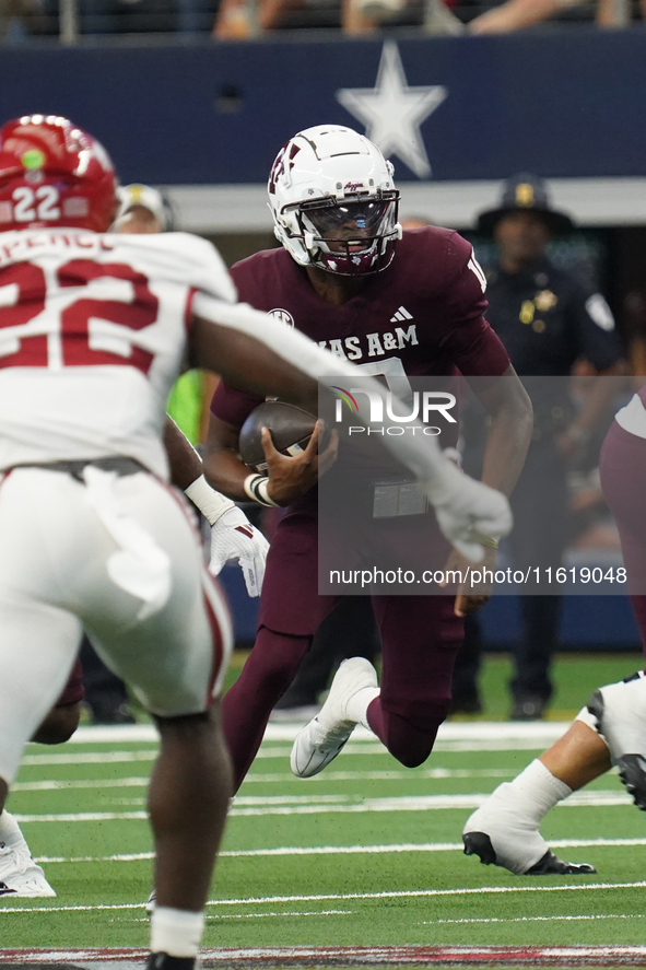 Texas A&M Aggies quarterback Marcel Reed #10 runs ahead against the Arkansas Razorbacks during the Southwest Classic match between the Arkan...