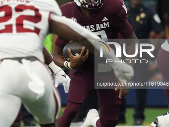 Texas A&M Aggies quarterback Marcel Reed #10 runs ahead against the Arkansas Razorbacks during the Southwest Classic match between the Arkan...