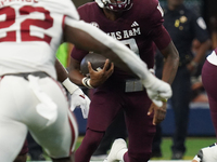 Texas A&M Aggies quarterback Marcel Reed #10 runs ahead against the Arkansas Razorbacks during the Southwest Classic match between the Arkan...