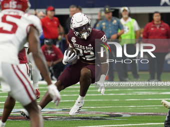 Texas A&M Aggies running back EJ Smith #22 runs the ball against the Arkansas Razorbacks during the Southwest Classic match between the Arka...