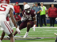 Texas A&M Aggies running back EJ Smith #22 runs the ball against the Arkansas Razorbacks during the Southwest Classic match between the Arka...