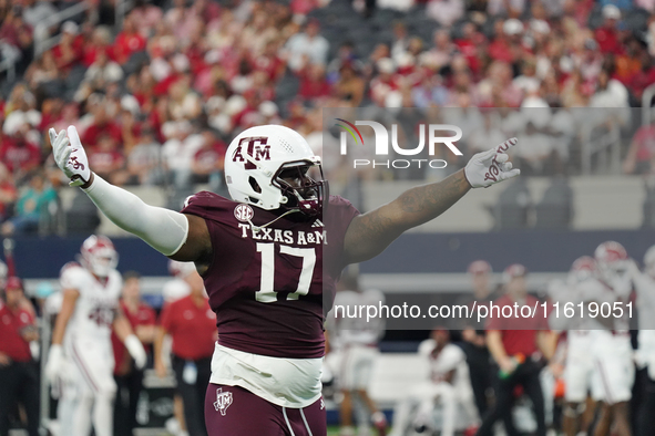 Texas A&M Aggies defensive lineman Albert Regis #17 celebrates against the Arkansas Razorbacks during the Southwest Classic match between th...