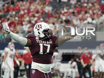 Texas A&M Aggies defensive lineman Albert Regis #17 celebrates against the Arkansas Razorbacks during the Southwest Classic match between th...