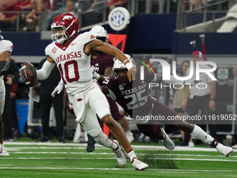 Arkansas Razorbacks quarterback Taylen Green #10 rushes out of the pocket against Texas A&M Aggies during the Southwest Classic match betwee...