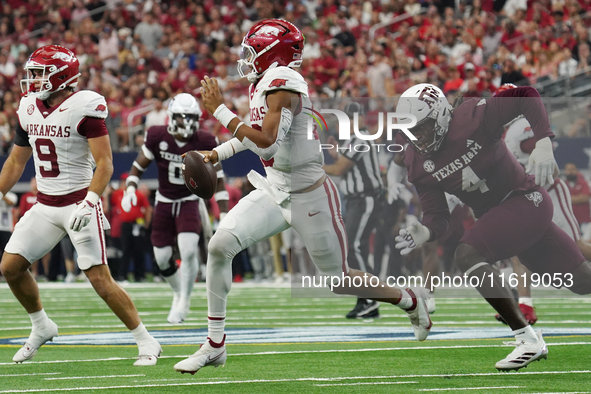 Arkansas Razorbacks quarterback Taylen Green #10 rushes out of the pocket against Texas A&M Aggies during the Southwest Classic match betwee...