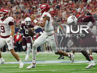 Arkansas Razorbacks quarterback Taylen Green #10 rushes out of the pocket against Texas A&M Aggies during the Southwest Classic match betwee...