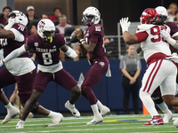 Texas A&M Aggies quarterback Marcel Reed #10 looks to throw a pass against the Arkansas Razorbacks during the Southwest Classic match betwee...