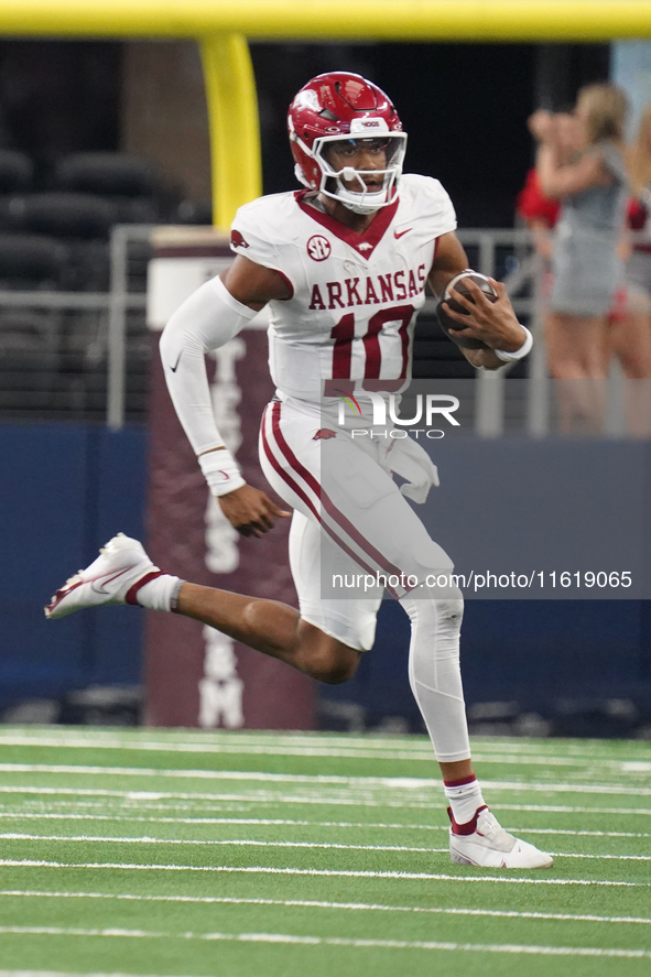 Arkansas Razorbacks quarterback Taylen Green #10 runs for positive yardage against the Texas A&M Aggies during the Southwest Classic match b...