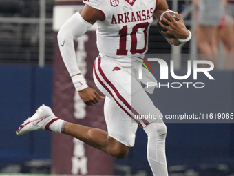 Arkansas Razorbacks quarterback Taylen Green #10 runs for positive yardage against the Texas A&M Aggies during the Southwest Classic match b...