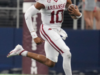 Arkansas Razorbacks quarterback Taylen Green #10 runs for positive yardage against the Texas A&M Aggies during the Southwest Classic match b...