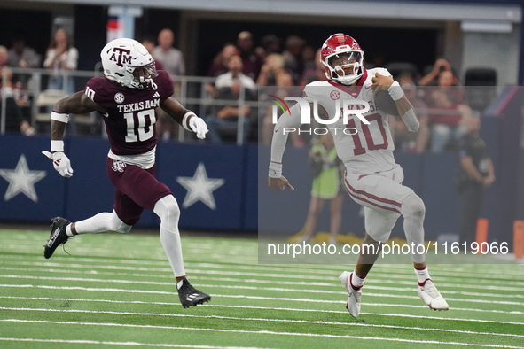 Arkansas Razorbacks quarterback Taylen Green #10 runs for positive yardage against the Texas A&M Aggies during the Southwest Classic match b...