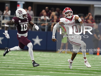 Arkansas Razorbacks quarterback Taylen Green #10 runs for positive yardage against the Texas A&M Aggies during the Southwest Classic match b...