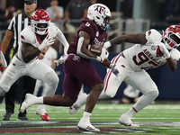 Texas A&M Aggies running back Amari Daniels #5 rushes with the ball against the Arkansas Razorbacks during the Southwest Classic match betwe...