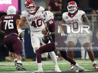 Texas A&M Aggies quarterback Marcel Reed #10 looks to throw a pass against the Arkansas Razorbacks during the Southwest Classic match betwee...