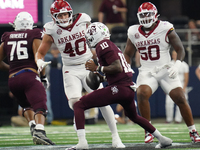 Texas A&M Aggies quarterback Marcel Reed #10 looks to throw a pass against the Arkansas Razorbacks during the Southwest Classic match betwee...