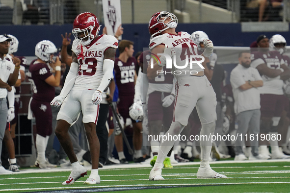 Arkansas Razorbacks defensive lineman Landon Jackson (#40) celebrates his tackle against Texas A&M Aggies quarterback Marcel Reed (#10) duri...