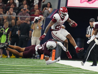 Arkansas Razorbacks running back Ja'Quinden Jackson #22 avoids a tackle by Texas A&M Aggies defensive back Marcus Ratcliffe #3 during the So...