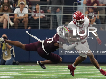 Arkansas Razorbacks running back Ja'Quinden Jackson #22 is tackled by Texas A&M Aggies linebacker Daymion Sanford #27 during the Southwest C...