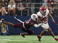 Arkansas Razorbacks running back Ja'Quinden Jackson #22 is tackled by Texas A&M Aggies linebacker Daymion Sanford #27 during the Southwest C...